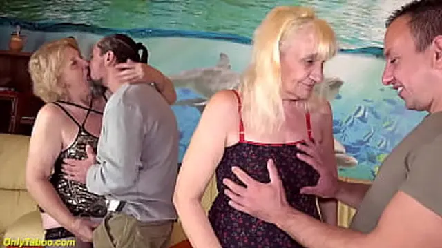 two horny milfs get fucked rough in the ass by their big dick toyboys at a spontaneous groupsex orgy